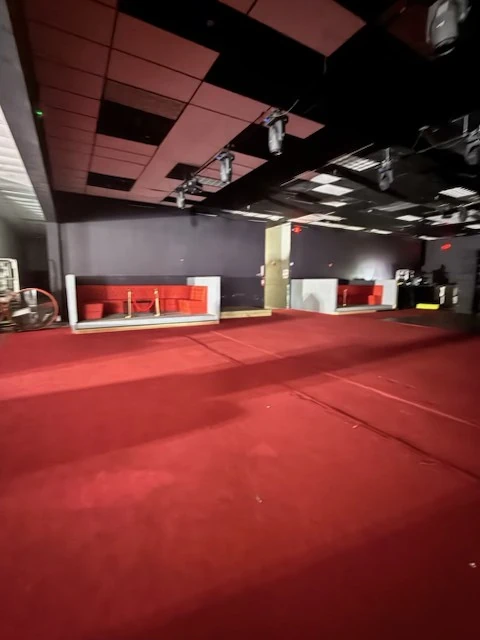 Wide view of the cleared club floor and seating