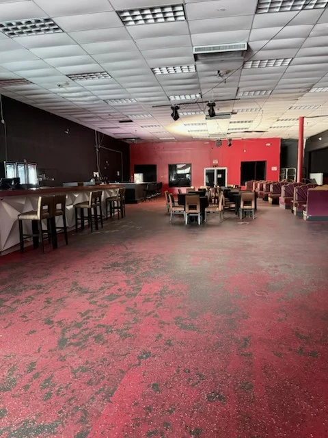 Cleared lounge area with tables and chairs arranged
